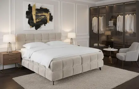 grand lit dans une chambre lumineuse